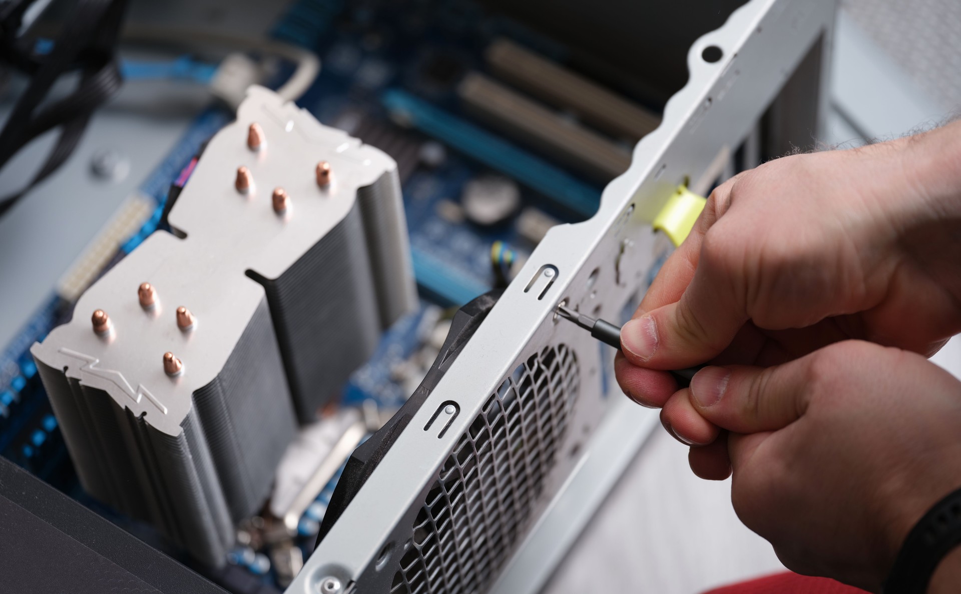 Technician repairing computer power supply closeup, Computer disassembly